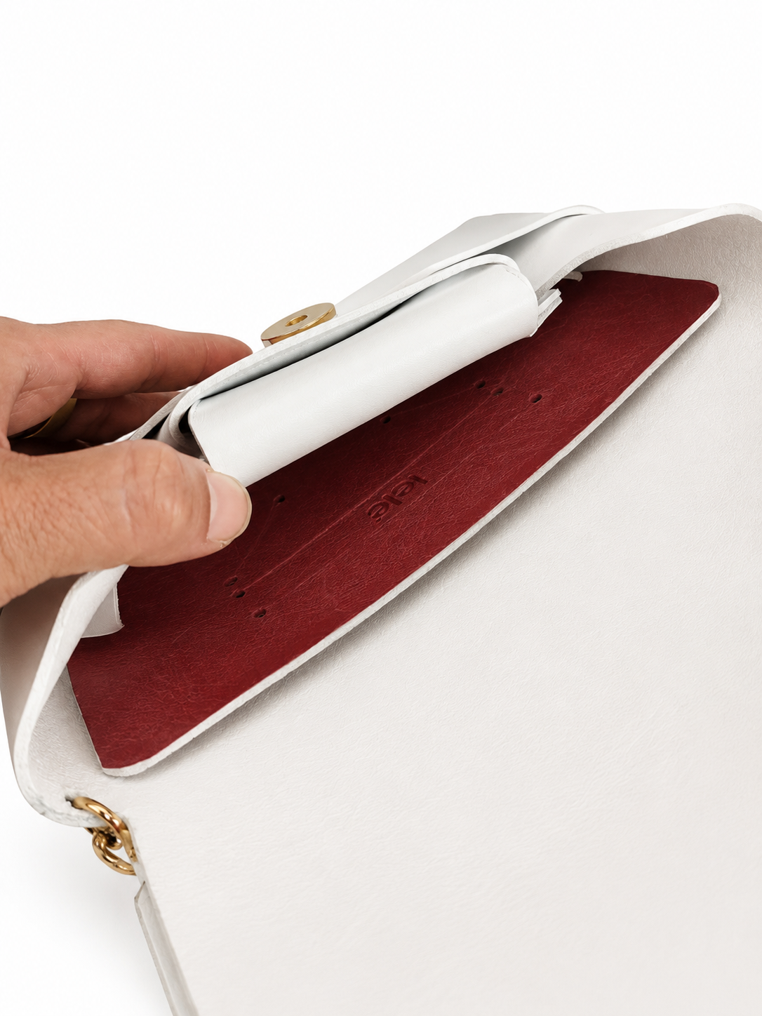 L'Essenziale — Clutch in Cuoio Toscano